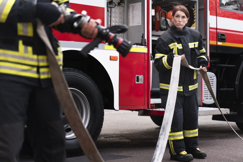 Male Female Firefighters Station Working Together